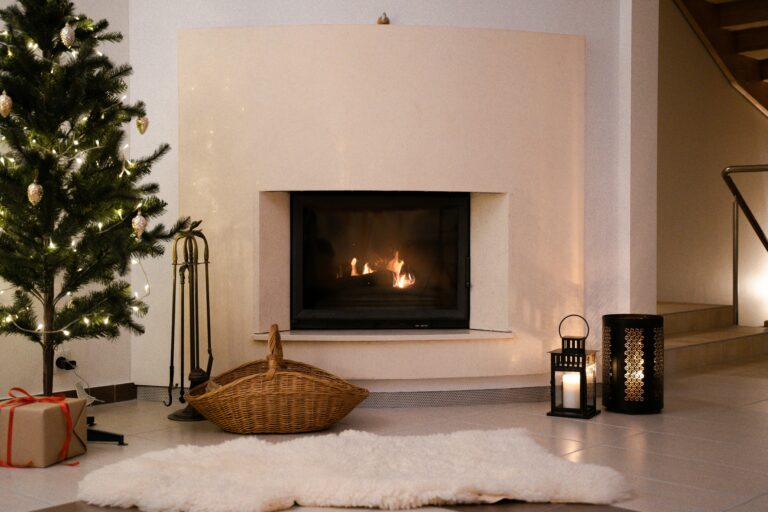 Warm Christmas atmosphere in a living room with a decorated tree and a glowing fireplace.